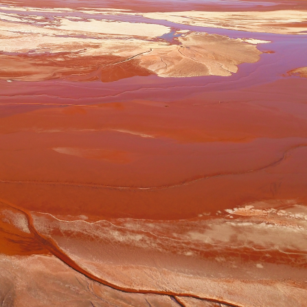 Aerial view of red mud disposal area with industrial processing